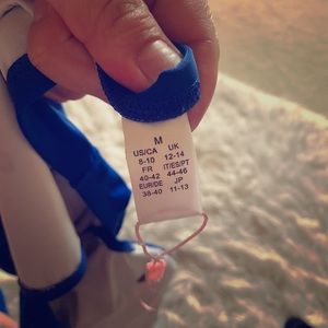 One piece blue swimsuit.